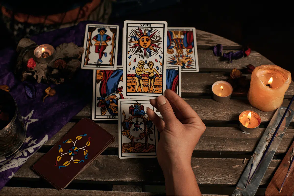 close up fortune teller reading tarot cards